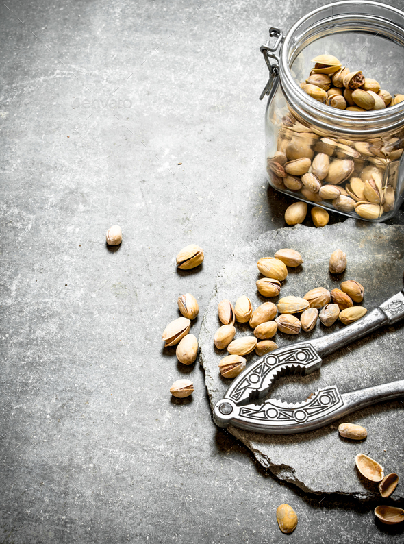 Pistachios in the jar with the Nutcracker. Stock Photo by Artem_ka