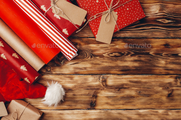 Christmas Background With Gift Boxes And Rolls Of Kraft Wrapping