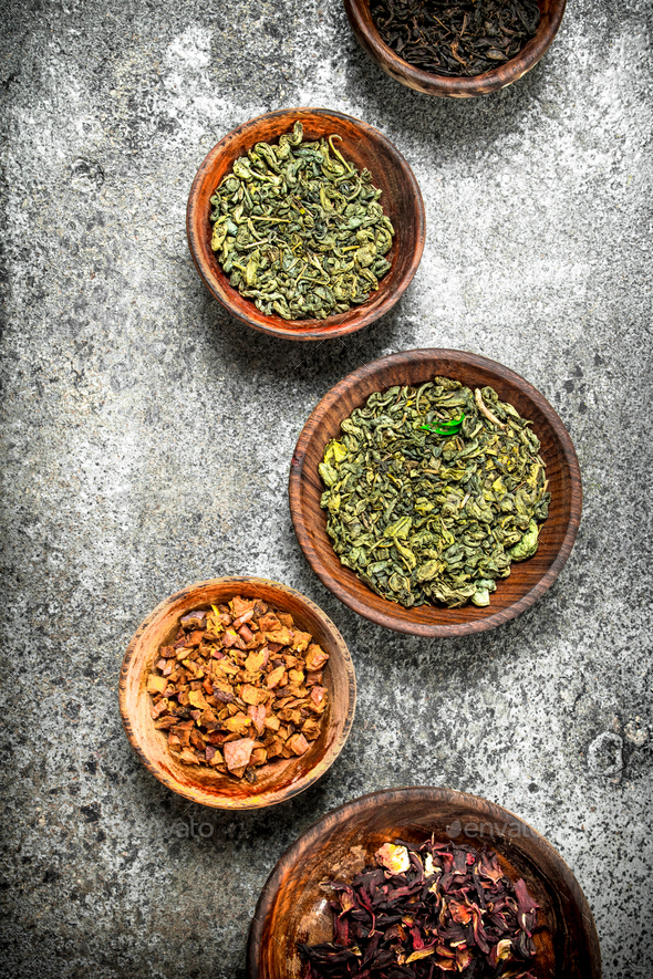 Different kinds of fragrant tea in bowls. Stock Photo by Artem_ka