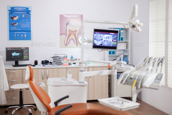 Modern orange dentist cabinet with sterile utensils