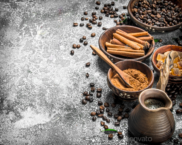 Fresh coffee in a clay turkey with crystals of sugar and cinnamon.