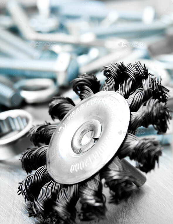 Grinding circle and other tools on the scratched metal background