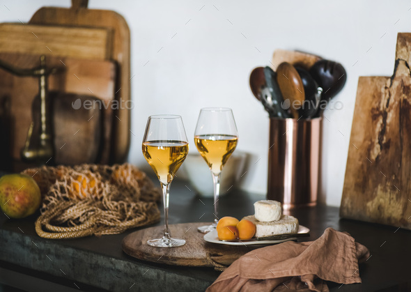 Two glasses of Trendy Orange or Amber wine and appetizers - Stock Photo - Images