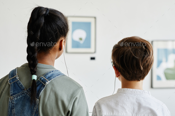 Children Using Audio Guide in Art Gallery