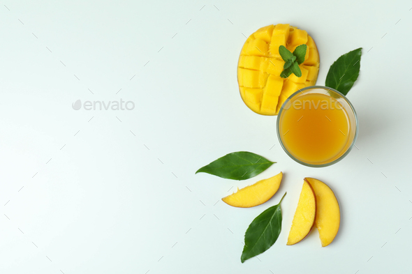 Mango juice and fruit on white background Stock Photo by AtlasComposer