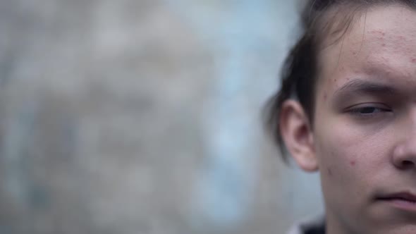 Portrait of a Teenager with Long Hair alt