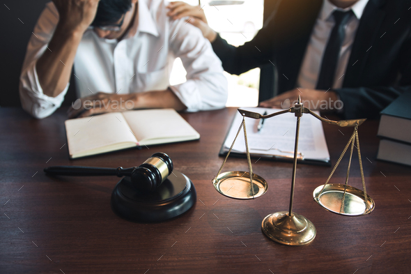 Lawyer is encouraging the client who estimates the trial and may not win the case in the office. - Stock Photo - Images