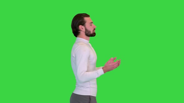 Man in Sportswear Walking and Breathing Deeply to Relax on a Green Screen Chroma Key