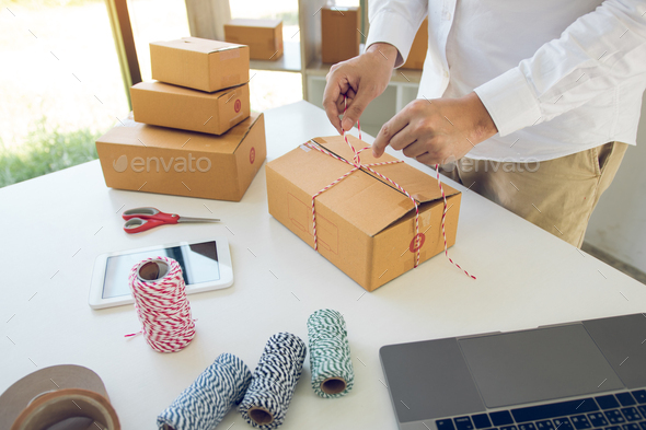 teenage product owners are packing small business packaging products in boxes