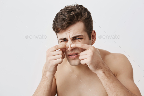 Naked Muscular Male With Appealing Appearance Frowning Face Touching Nose Having Skin