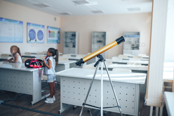 School telescope for teaching schoolchildren, space exploration in the school curriculum - Stock Photo - Images