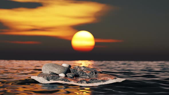 Stone in the ocean with ripple at sunset.