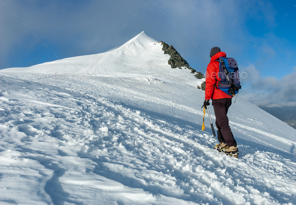 Mountaineer climbs a snowy peak in swiss Alps. Zermatt, Switzerland. - Stock Photo - Images