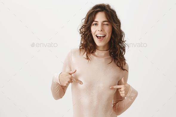 Smiling shy girl in stylish t-shirt and underwear Stock Photo by