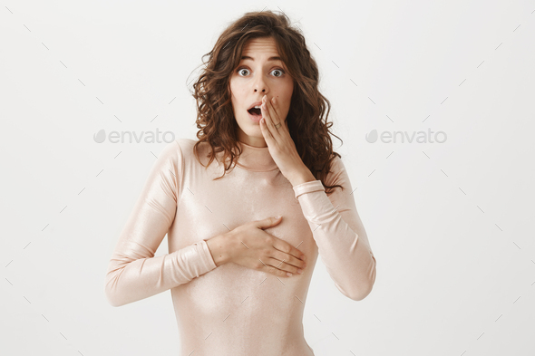 the woman covers her breasts with her hand. without face Stock Photo