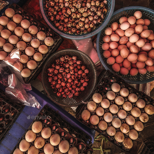 Top view on a assortment of loose eggs on a market, short circui