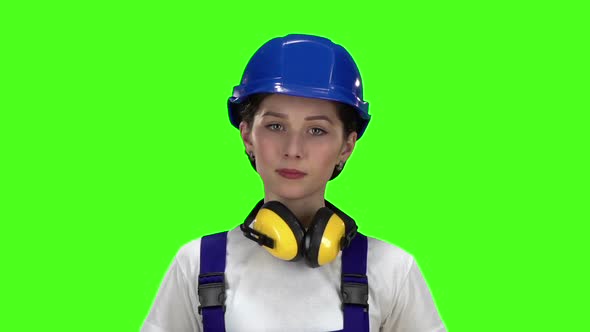 Girl Shows Them a Gesture with Her Hands Cross To the Cross. Green Screen. Slow Motion alt