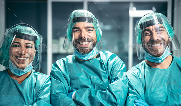 Surgeons smiling after a successful surgical operation