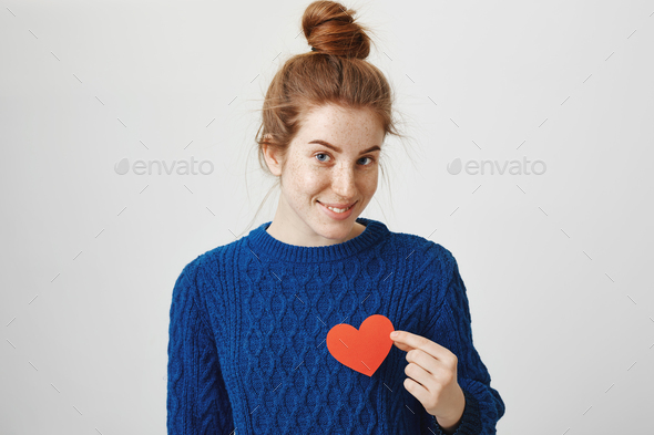 Heart beats faster when I see you. Portrait of attractive sensual redhead female with freckles