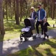 Happy Mom And Dad Walking With Children In The Recreation Park - VideoHive Item for Sale