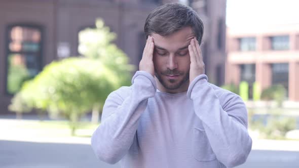 Headache Portrait of Tense Handsome Man in Office alt