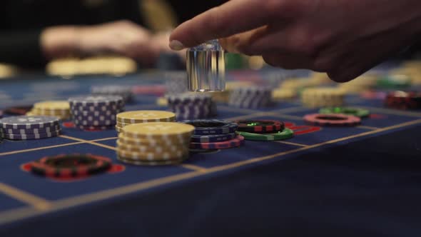 Gaming Chips on the Gaming Table in the Casino Dolly is Put on the Chip alt