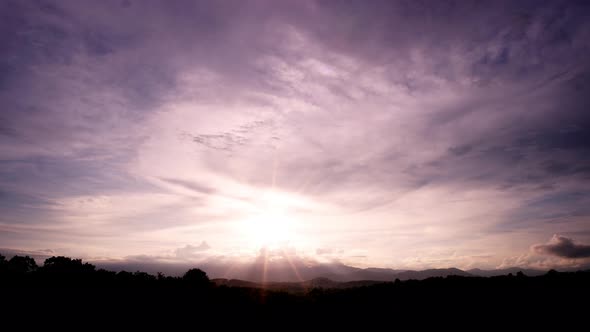 Dramatic Cumulus tropical cinematic cloudscape building up over the mountain turning into a tropical alt