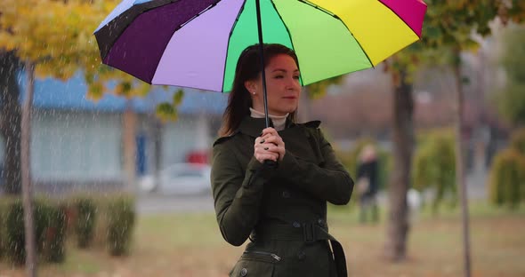 Woman Hiding Under Umbrella From the Rain Slow Motion