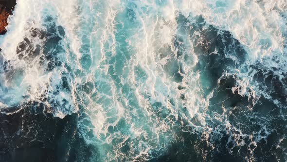 Beautiful Transition of Spray and Foam From Sea Waves Shimmering in the Rays of the Setting Sun alt