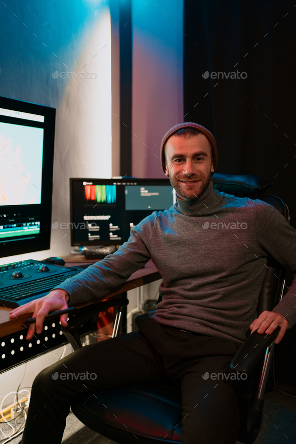 Male Video Editor Working on His Personal Computer with Big blank