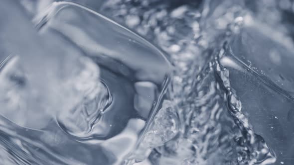 Super Slow Motion Detail Shot of Pouring Vodka on Ice Cubes at 1000 Fps alt