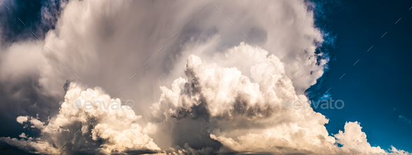 Dramatic sky, light from heaven. Cumulus stormy clouds in summer