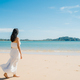 Beautiful young Asian woman happy relax walking on beach near sea. - PhotoDune Item for Sale