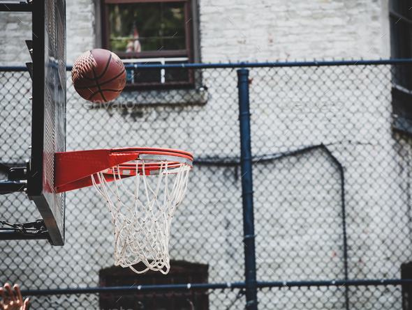 Basketball hoop in a neighborhood playing field in New York.