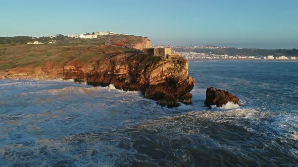 Aerial View of Lighthouse and Big Waves, Portugal alt