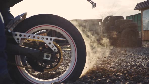 Professional Motorcyclist Drift and Turns on a Motorcycle on the Ground a Biker Does a Trick on a alt