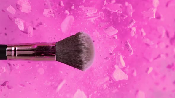 Super Slow Motion Shot of Makeup Brush and Pink Powder Explosion at 1000 Fps alt