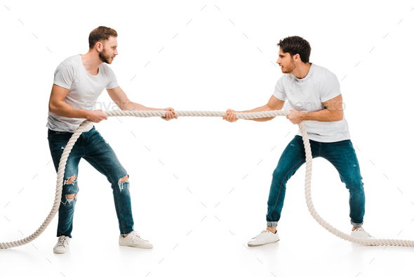 young men pulling rope and playing tug of war isolated on white Stock Photo  by LightFieldStudios