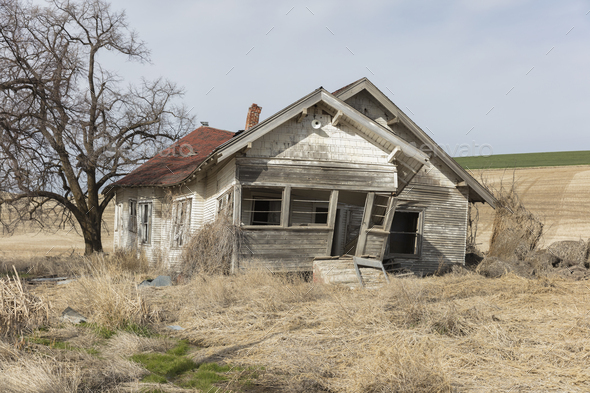 Abandoned homestead in a rural landscape, falling down - Stock Photo - Images
