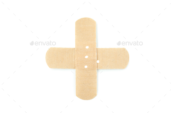 Cross made of medical patch, isolated on white background