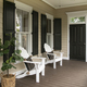 Charleston style porch with chairs and entry door on southern home - PhotoDune Item for Sale