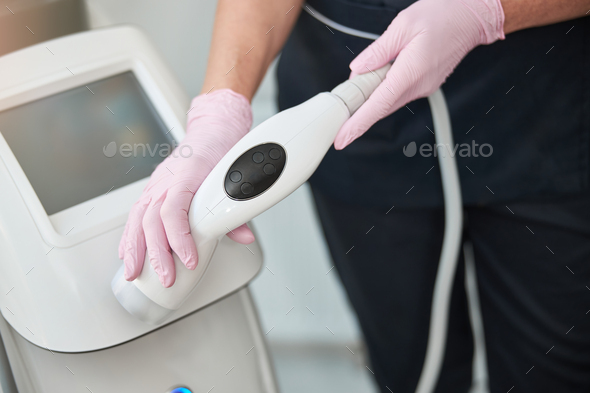 Professional spa staff operating an ultrasonic cavitation machine
