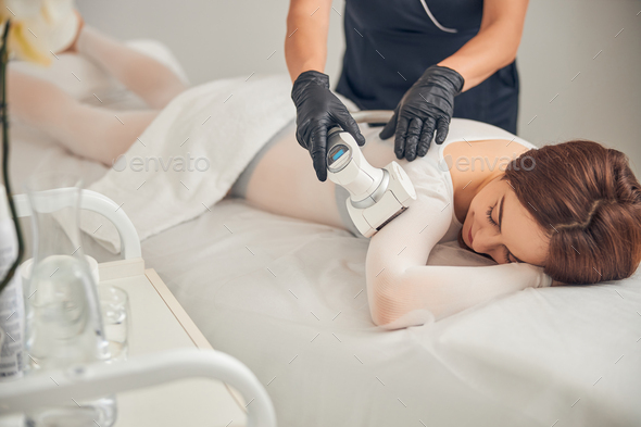 Cavitation treatment of woman body at beauty salon - Stock Photo - Images