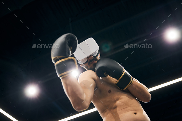 Athlete doing a boxing practice in virtual reality - Stock Photo - Images