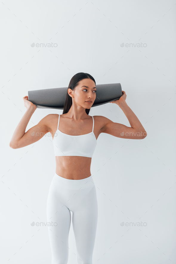 Young caucasian woman with athletic body shape is indoors at daytime Stock  Photo by mstandret