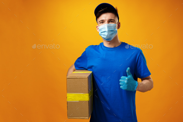 Courier Delivery Man In Medical Latex Gloves And Mask Safely