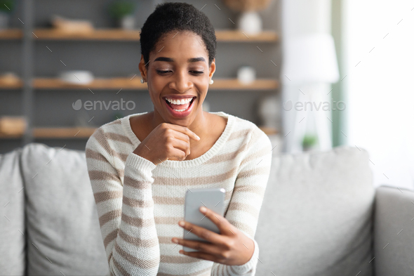Online Dating App. Young Black Single Woman Using Smartphone At Home
