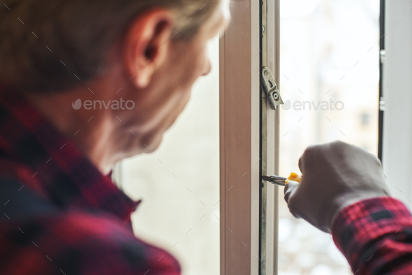 Sensitive Settings Close Up Of Senior Handyman Setting New Windows Stock Photo By Friends Stock