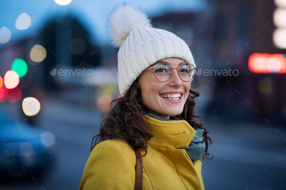 Happy winter woman on urban street - Stock Photo - Images