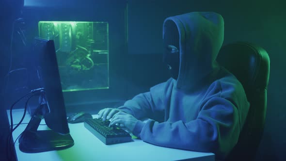 Cybercriminal Hacker Typing and Getting Upset